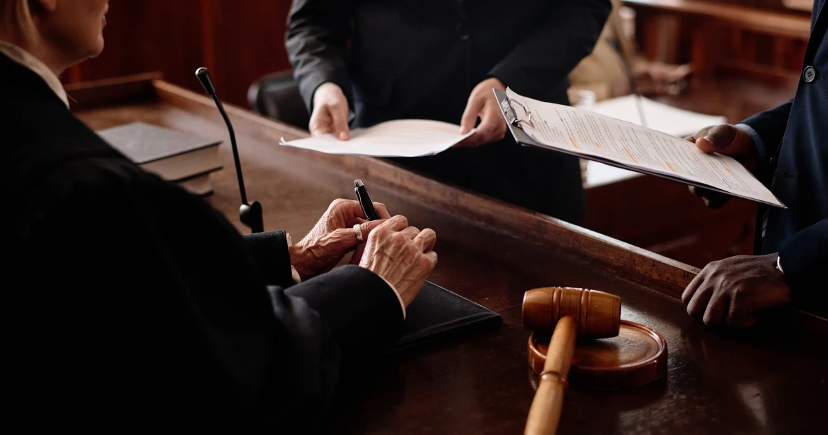 Close-up of accusation and protection sides with juridical documents